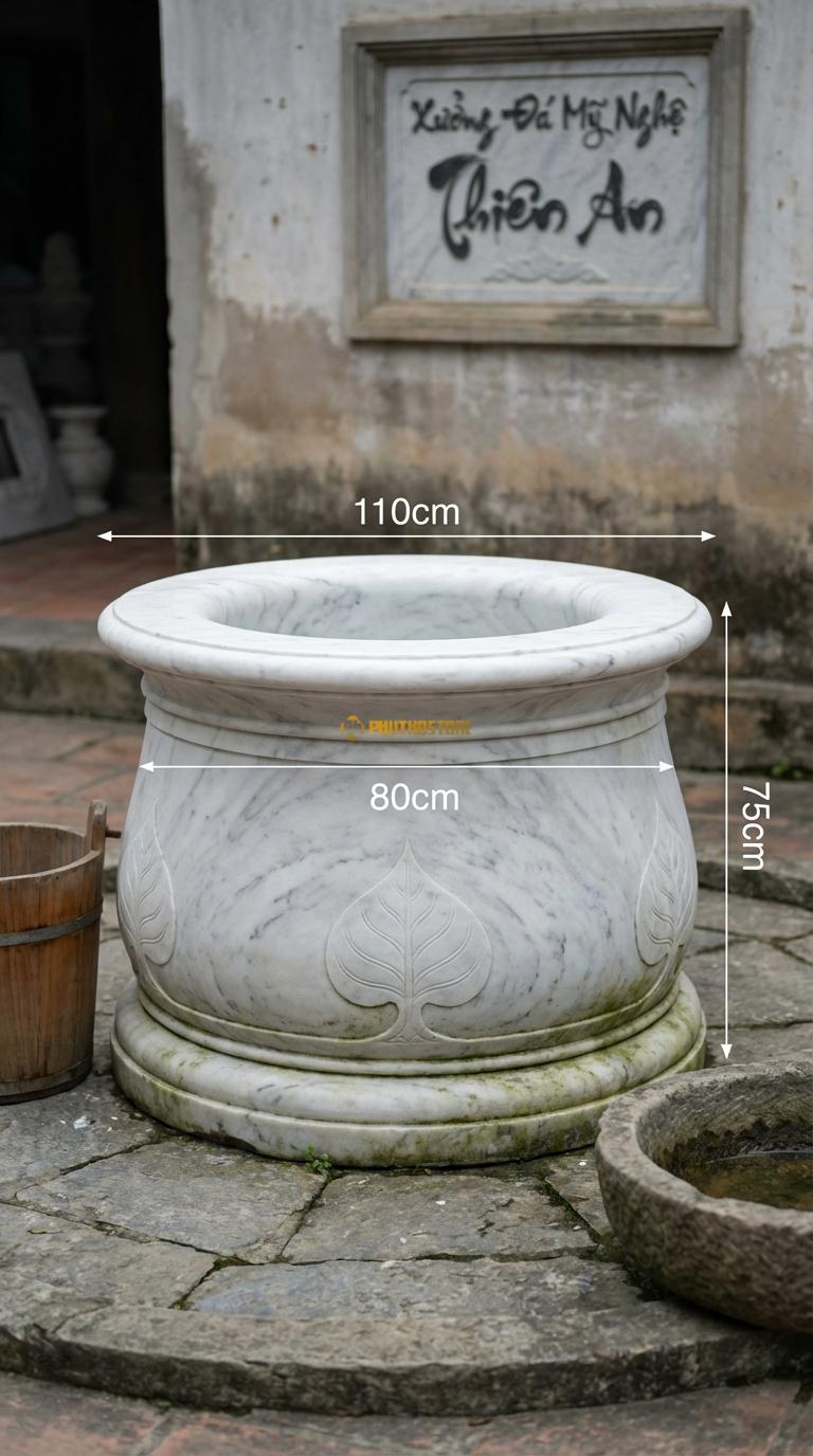 Giếng Cổ Loe Miệng Đá Trắng Yên Bái Miệng giếng loe rộng ra ngoài, thân chạm lá đề, Kích thước đường kính Miệng 110cm/Thân 80cm x Cao 75cm